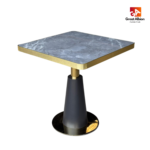 Grey marble dining table with gold and black base for contemporary restaurants.