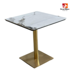White patterned marble dining table with gold base for upscale cafés and lounges.