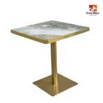 Green forest marble dining table with gold base for luxury restaurant interiors.