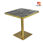 Black rain marble dining table with gold base for luxury restaurant settings.