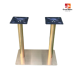 Round column double metal table base in gold finish designed for large tabletops in upscale restaurants, hotels, and cafés.