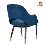 Luxury café dining chair upholstered in premium velvet with supportive ergonomic curved backrest design.