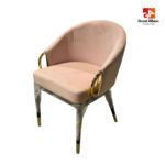 Velvet gold ring accent dining chair with curved backrest, cushioned seat, and black legs with gold-tipped detailing.