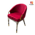 Modern velvet accent dining chair with curved silhouette, sturdy wooden frame, and refined gold decorative ring highlights.