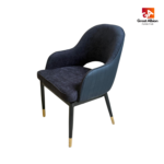 Modern quilted back dining chair with curved wraparound design, textured upholstery, stitched detailing, and black legs with gold tips.