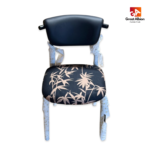 Contemporary patterned dining chair with curved black backrest, cushioned seat, and bold fabric upholstery for modern interiors.