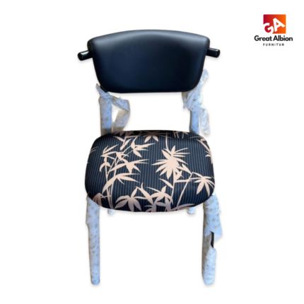 Contemporary patterned dining chair with curved black backrest, cushioned seat, and bold fabric upholstery for modern interiors.